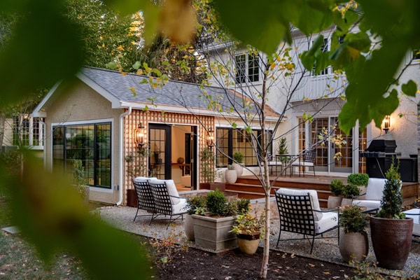 Custom residential landscape design featuring outdoor living spaces, planting, and architectural integration.