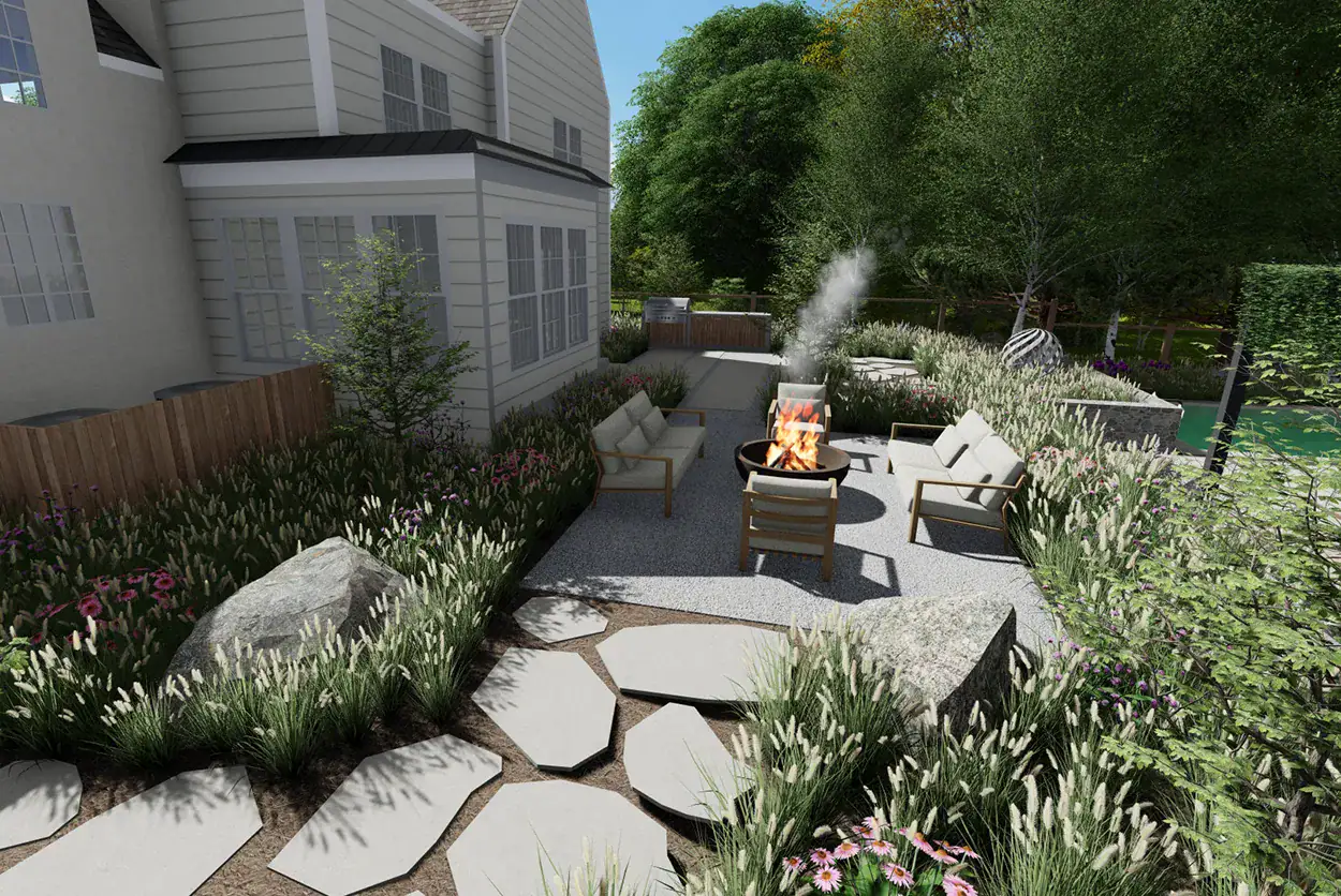 Gravel fire pit patio with lounge chairs, boulders, and a flagstone path bordered by ornamental grasses and perennials