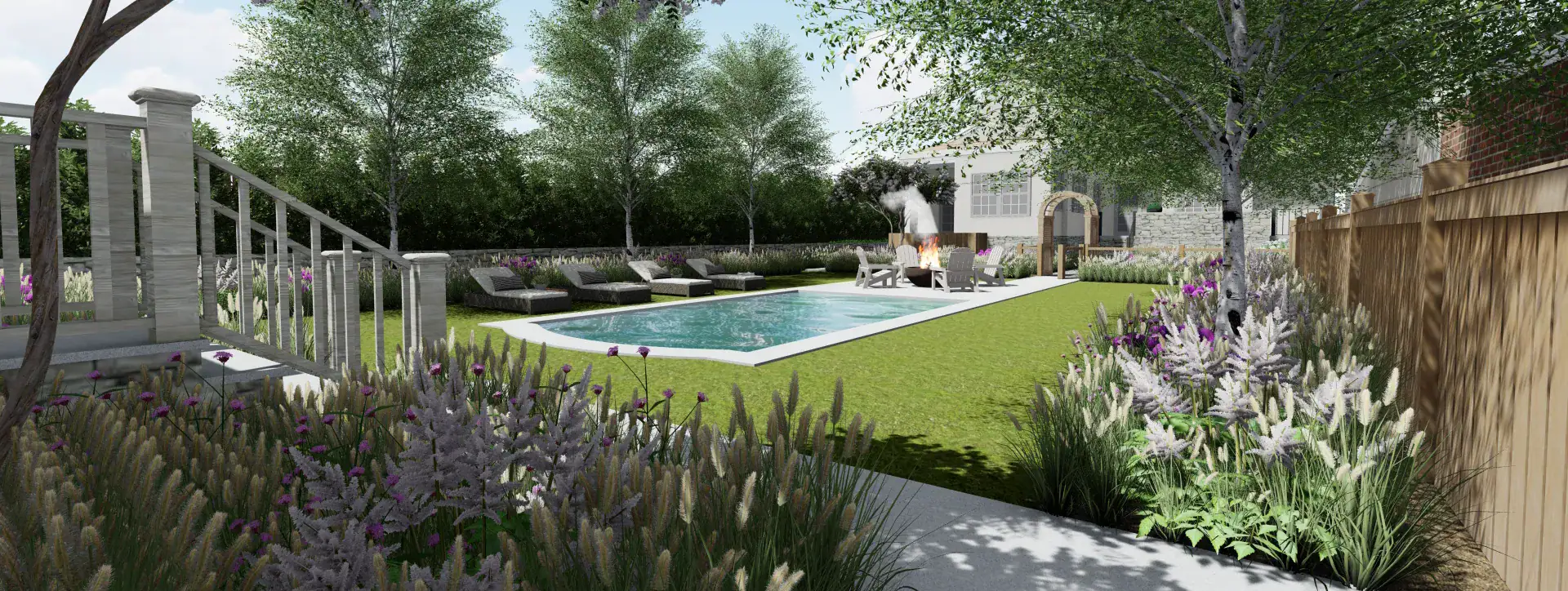 Backyard pool and lawn with lounge chairs, a fire pit seating area, and ornamental grass and perennial plantings along the fence line
